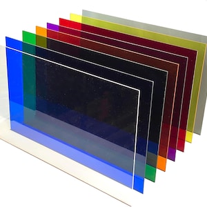 May include: A set of 10 colored acrylic sheets in various shades of blue, green, red, orange, yellow, and purple. The sheets are stacked on top of each other, with the largest sheet at the bottom and the smallest sheet at the top.