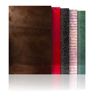 May include: A collection of five rectangular panels with varied textures and colors. The panels include a dark brown speckled surface, a glossy red, a black textured surface, a pink and white marbled pattern, and a green textured surface.