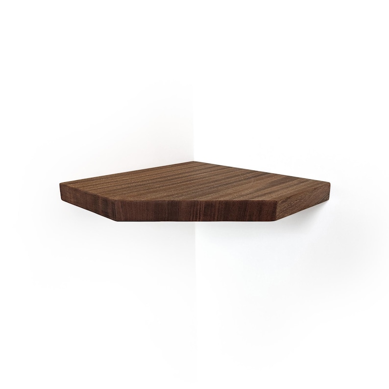 Mahogany corner shelf with walnut stain and straight edges on a white corner wall.