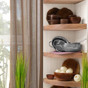 Oak corner shelves displayed in kitchen with decorations.