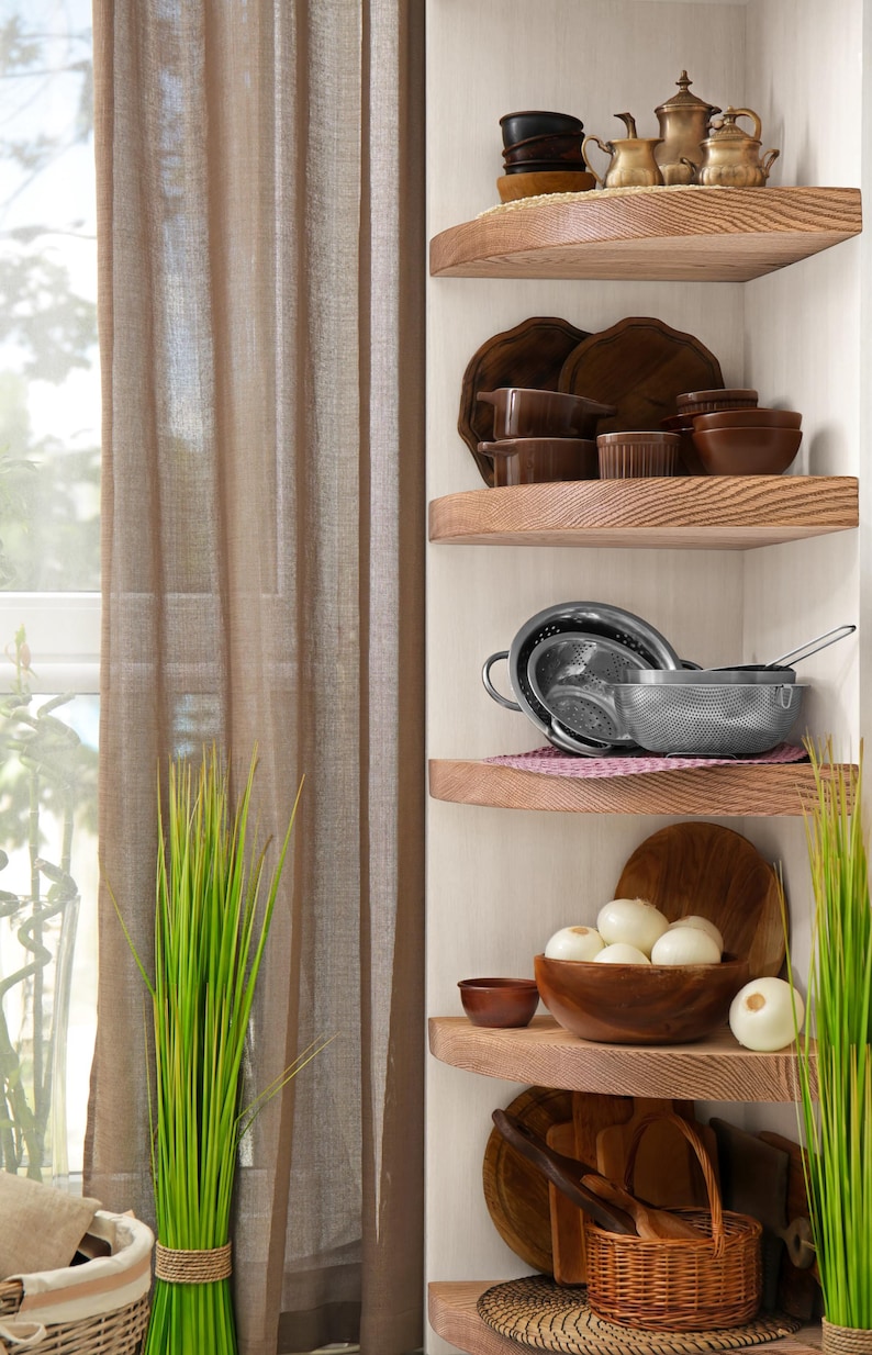 Oak corner shelves displayed in kitchen with decorations.