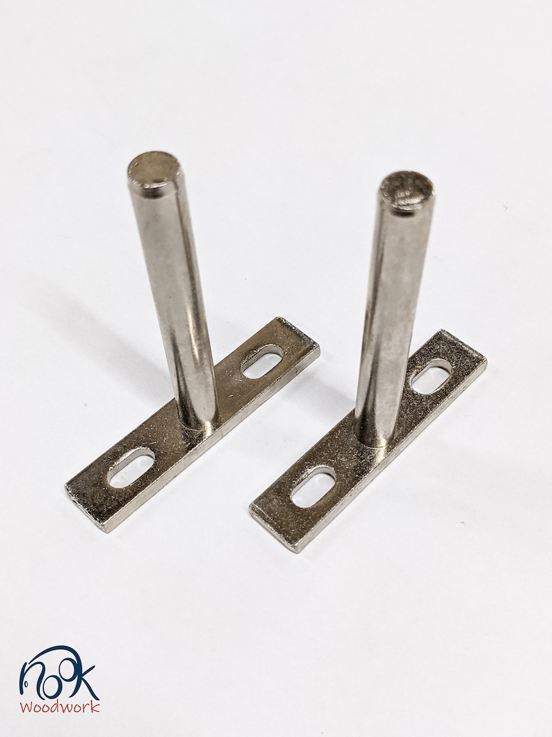 Silver t-shaped floating shelf brackets.