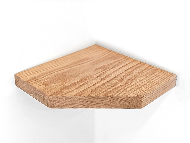 Front view of an oak corner shelf.