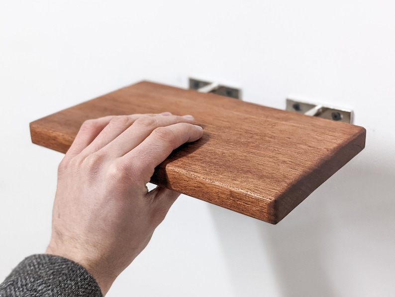 natural wood floating shelves with brackets