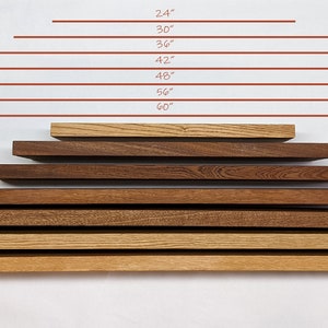 May include: A set of eight wooden shelves in various sizes, ranging from 24 inches to 60 inches in length. The shelves are arranged in a pyramid shape, with the smallest shelf at the top and the largest shelf at the bottom. The shelves are made of different types of wood, including oak and walnut.