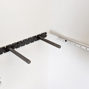 The two types of brackets that are used to install the corner floating shelves.