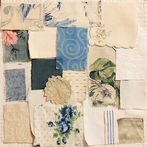 May include: A patchwork of fabric swatches in various patterns and textures. Includes floral prints in blue and pink, a blue swirl design, a crocheted doily, and textured solids in cream, blue, and green. The arrangement is on a white background.
