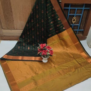 Kanchi Soft Silk saree with rich zari weaving and grand pallu, Dark green soft art silk saree with copper zari weave