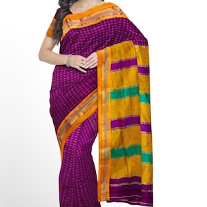 May include: A purple and gold saree with a geometric pattern. The saree has a yellow border with green stripes.