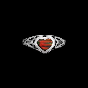 May include: A silver ring with a heart-shaped opal gemstone. The opal has red, orange, and green colors.