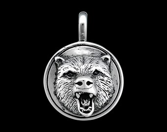 May include: Silver pendant featuring a detailed, snarling bear head in a round frame.