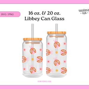 May include: Two clear glass can cups with wooden lids and straws. The cups are decorated with a pattern of pink flowers and orange ladybugs. The text "16 oz. & 20 oz. Libbey Can Glass" is at the top of the image. The text "FOR VINYL USE" is at the bottom of the image.