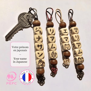 Japanese keychain customization with name translated into Japanese and Japanese zodiac sign, pyrographed beads
