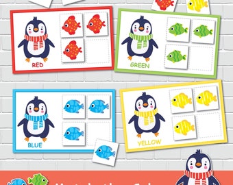 以下が含まれることがあります： マフラーをつけた漫画のペンギンが登場する、教育的な色のマッチングゲーム。ゲームには、赤、緑、青、黄色のカードが含まれており、それぞれに一致する魚がいます。「Match the Colors」というテキストが一番下にあります。