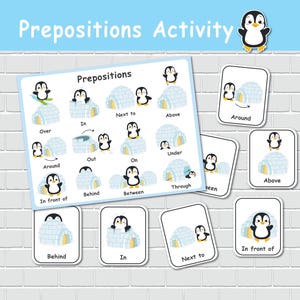 May include: A colorful educational activity set featuring penguins and igloos. The set includes a large card with prepositions and smaller cards with matching illustrations. The text "Prepositions Activity" is at the top. The cards are designed for learning spatial relationships.