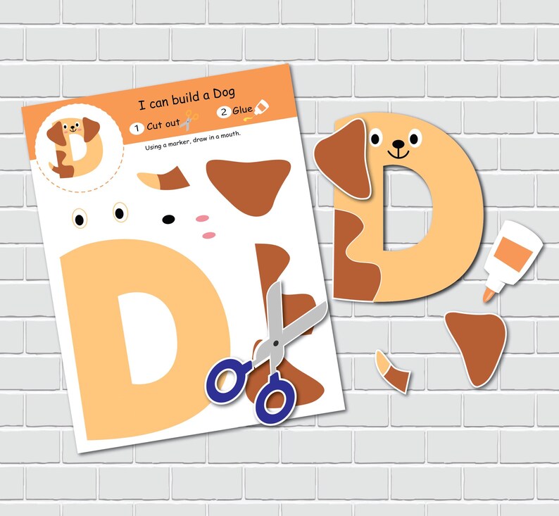 May include: A printable craft activity for kids to build a dog. The printable features a letter D with cut-out pieces to create a dog shape. The instructions say "I can build a Dog", "1 Cut out", "2 Glue", and "Using a marker, draw in a mouth".