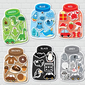 May include: Six colorful jars with different objects inside. Each jar has a label with a color name: Green, Blue, Red, Brown, Black, and Grey. The objects inside each jar are related to the color of the jar.