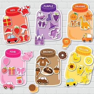 May include: Six colorful jars with lids, each containing different objects. The jars are labeled with the colors: red, purple, orange, pink, brown, and yellow. The objects inside the jars are: a present, a strawberry, a butterfly, a UFO, a witch's hat, a dinosaur, an orange, a fish, a dinosaur, a balloon, a present, a bow, a sweater, a hedgehog, an acorn, a sunflower, a duck, a star, and a sun.