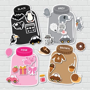 May include: Four jars with different colored lids and various images inside. The jars are labeled "Black", "Grey", "Pink", and "Brown".