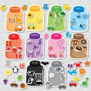 May include: A set of ten colorful jars with lids, each containing different objects. The jars are labeled with the colors: orange, yellow, green, blue, red, purple, pink, brown, black, and grey. The objects inside the jars are various colors and shapes, including a dinosaur, a car, a sunflower, a cactus, a rocket, a hat, a pig, a donut, a house, and an elephant.
