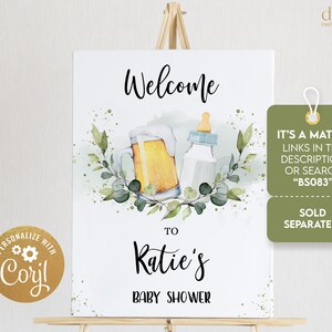 May include: Welcome to Katie's Baby Shower sign with a green watercolor floral design, a beer mug, and a baby bottle. The sign also includes the text "It's a Match! Links in the description or search "BS083" Sold Separately"