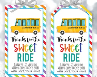 May include: Two printable gift tags with a yellow school bus illustration and the text "Thanks for the Sweet Ride". The tags have a rainbow striped background and the text "Thank you so much for keeping our students safe! With love, your name."