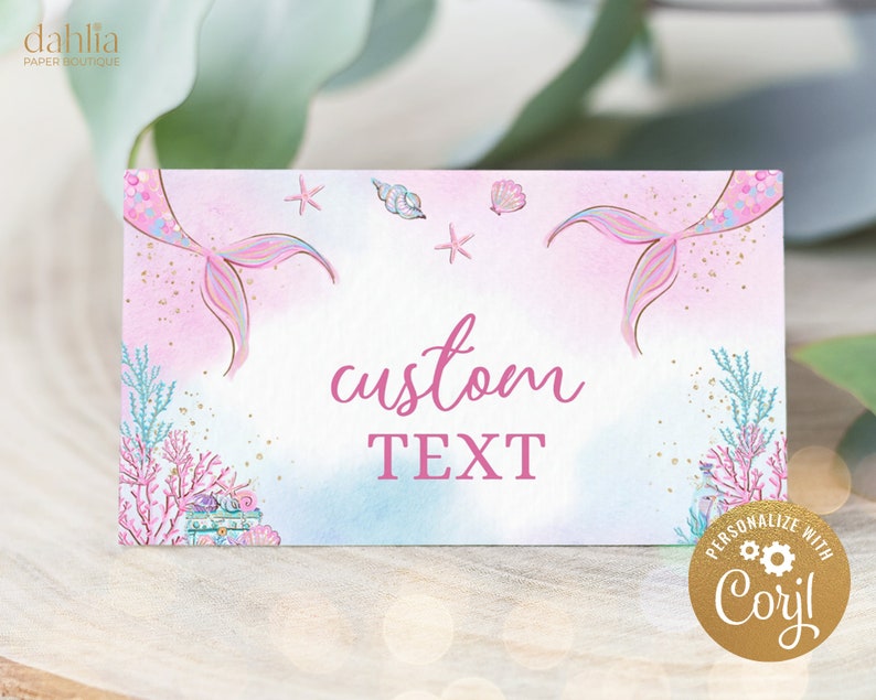 May include: Pink and blue mermaid tail printable party favor tags with a gold glitter background. The tags feature a mermaid tail, seashells, and starfish. The text "custom text" is written in pink. The tags are personalized with "Cori!" in a gold circle.