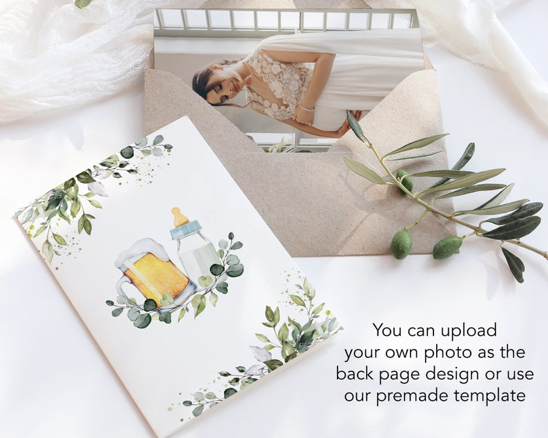 May include: A white card with a watercolor illustration of a beer mug and a baby bottle surrounded by green leaves. The text "You can upload your own photo as the back page design or use our premade template" is printed below the illustration.