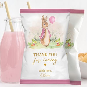 May include: Pink and white favor bag with a watercolor illustration of a bunny holding a pink balloon. The bag has a gold border and the text "Thank you for coming" with a heart and "With love, Olivia".