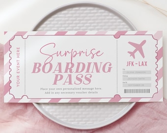 May include: A pink and white striped boarding pass with the text "Surprise Boarding Pass" and "JFK-LAX". The pass has fields for "To", "From", and "Date".