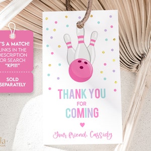 May include: Pink and white thank you tag with a bowling ball and pins graphic. The tag says "Thank You for Coming" and "Your friend, Cassidy".