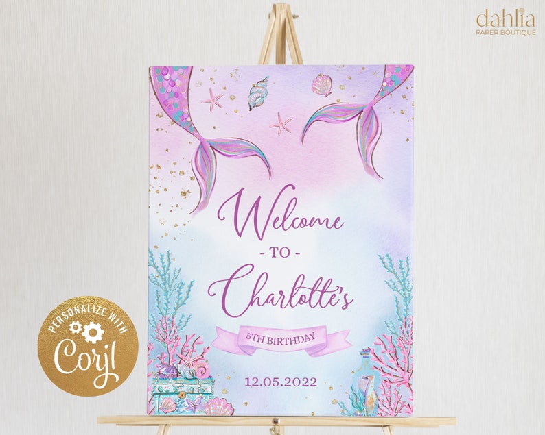 May include: Welcome to Charlotte's 5th Birthday party sign with a mermaid tail, seashells, and a treasure chest. The sign is on a wooden easel.