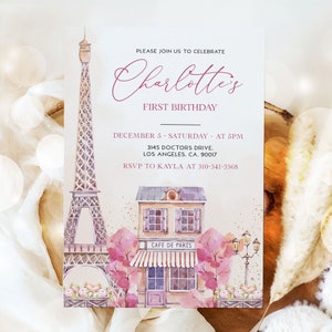 May include: A pink and white invitation with a watercolor illustration of the Eiffel Tower and a Parisian cafe. The text reads "Please join us to celebrate Charlotte's First Birthday, December 5 - Saturday - at 5pm, 3145 Doctors Drive, Los Angeles, CA. 90017, RSVP to Kayla at 310-341-3368".