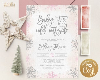 May include: A baby shower invitation with a winter theme. The invitation features the text "Baby, it's cold outside" in silver glitter. Pink and silver snowflakes decorate the edges. The invitation includes details for the event, including the date, time, and location.
