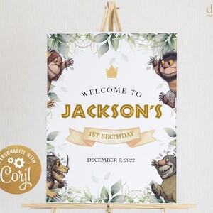 May include: A white welcome sign with green foliage and illustrations of furry creatures. The sign reads "Welcome to Jackson's 1st Birthday December 5, 2022".