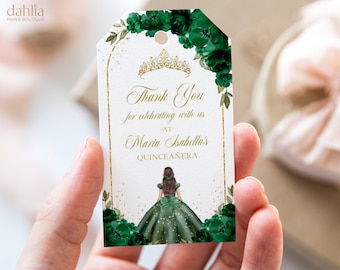 May include: Green and gold thank you tag with a crown and floral design. The text reads "Thank You for celebrating with us -at- Maria Isabella's Quinceañera".