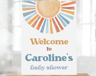 Könnte beinhalten: Willkommen zur Babyparty von Caroline Schild mit einem Aquarell-Sonnenmotiv in Blau-, Orange- und Gelbtönen.