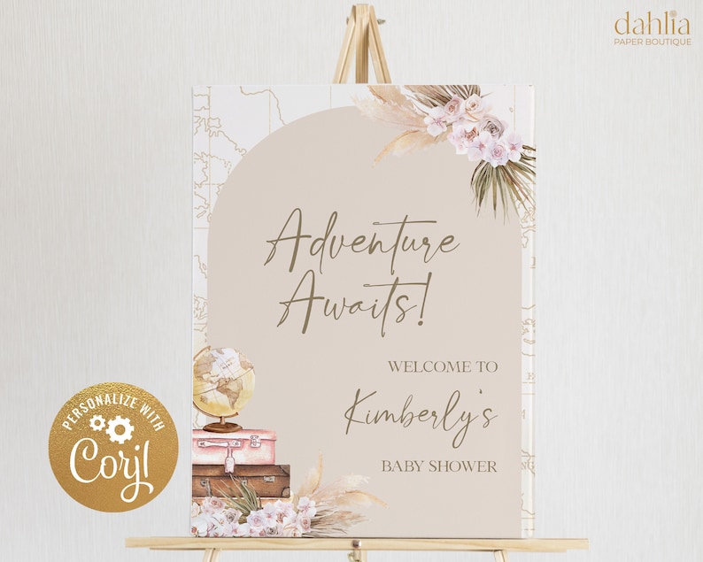 May include: A welcome sign for a baby shower with a light brown background and the text "Adventure Awaits!" in brown script. The text "Welcome to Kimberly's Baby Shower" is also in brown text. The sign is decorated with a globe, suitcases, and floral accents.