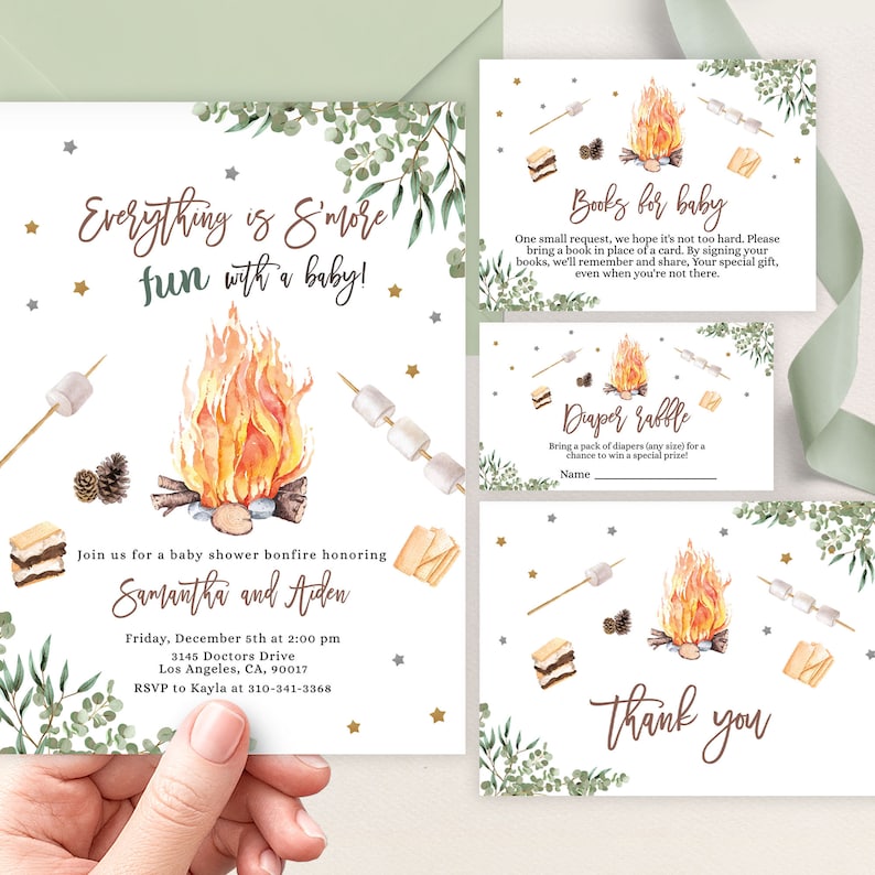 May include: A baby shower invitation with a campfire theme. The invitation features a watercolor illustration of a campfire with marshmallows on sticks, a s'more, and a pine cone. The text reads "Everything is S'more fun with a baby!" and includes details about the event, including the date, time, location, and RSVP information.