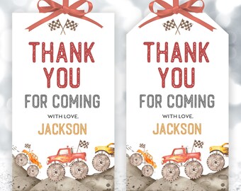 May include: Two white thank you tags with red and gray text. The text says "Thank You for Coming" with the name "Jackson" below. The tags are decorated with a red ribbon and a watercolor illustration of monster trucks.