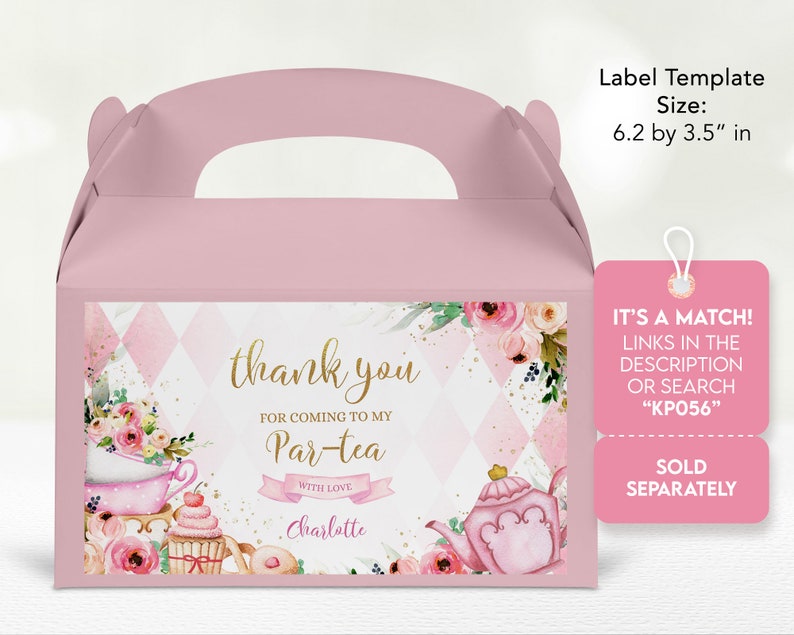 May include: Pink and gold favor box with a tea party theme. The box has a handle and features a watercolor illustration of a teapot, cupcakes, and flowers. The text on the box reads "thank you for coming to my Par-tea with love Charlotte".