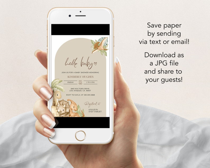 May include: A smartphone displays a baby shower invitation with a dinosaur theme. The invitation features the text "hello baby" and event details. The phone also displays text that says "Save paper by sending via text or email! Download as a JPG file and share to your guests!"