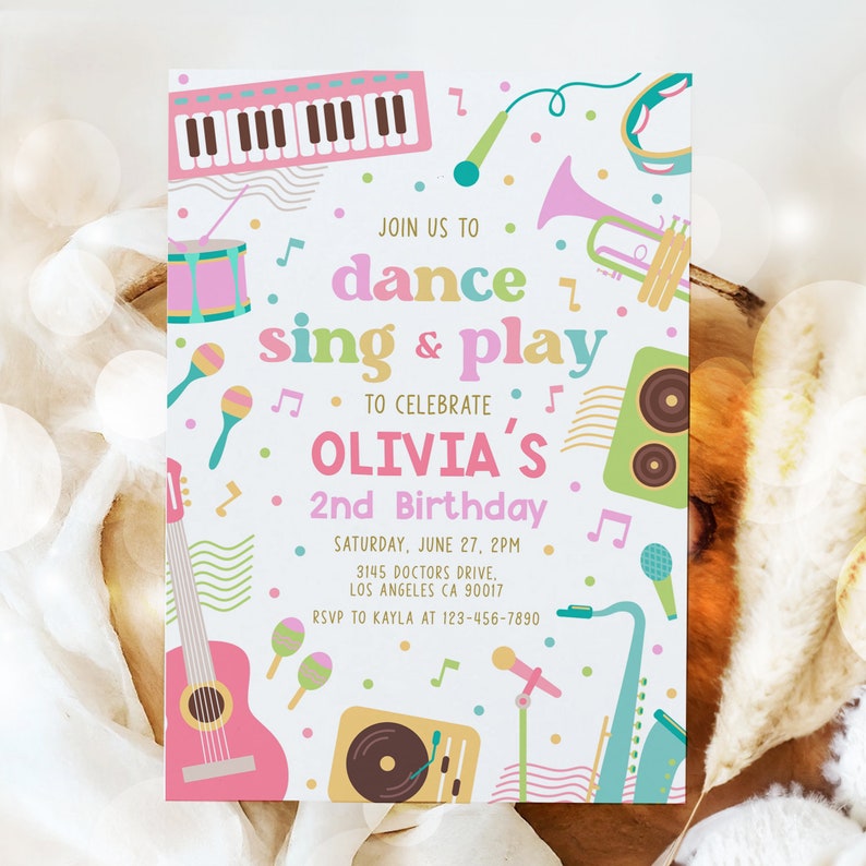 May include: A colourful invitation featuring musical instruments such as a keyboard, guitar, microphone, trumpet, and drums. The text reads "Join us to dance sing & play to celebrate Olivia's 2nd Birthday. Saturday, June 27, 2PM 3145 Doctors Drive, Los Angeles CA 90017 RSVP to Kayla at 123-456-7890"