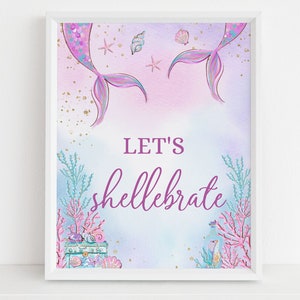 May include: A printable sign with a mermaid tail design and the text "Let's shellebrate". The background is a watercolor wash of pink, purple, and blue with gold glitter accents.