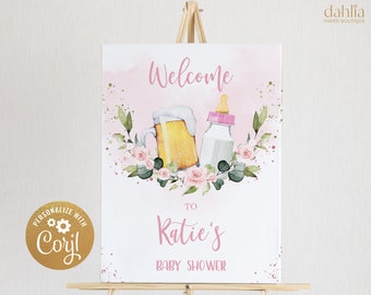 May include: Welcome to Katie's Baby Shower sign with a pink watercolor background. The sign features a beer bottle and a baby bottle with pink flowers and greenery around them.