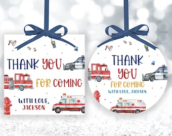 May include: Two thank you tags for a party. One is a square tag with a red fire truck, a police car, and an ambulance. The other is a round tag with a red fire truck, a police car, and an ambulance. Both tags have the text "Thank You for Coming" and "With Love, Jackson".