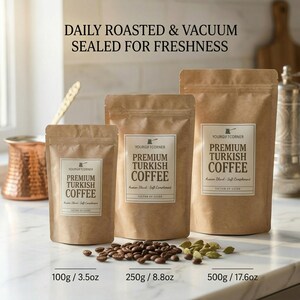 Three sizes of premium Turkish coffee kraft paper pouches (100g, 250g, 500g) labeled daily roasted and vacuum sealed for freshness on a marble counter.