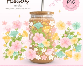 May include: A digital illustration of a glass jar with a brown lid and a straw. The jar is filled with a brown liquid and surrounded by pink, yellow, and blue hibiscus flowers. The text "Tropical Bloom Hibiscus" is at the top of the image. The text "PNG ONLY" is below the image of the jar. The text "Libbey Glass Can 16oz Size 9.75" x 5" is below the text "PNG ONLY".