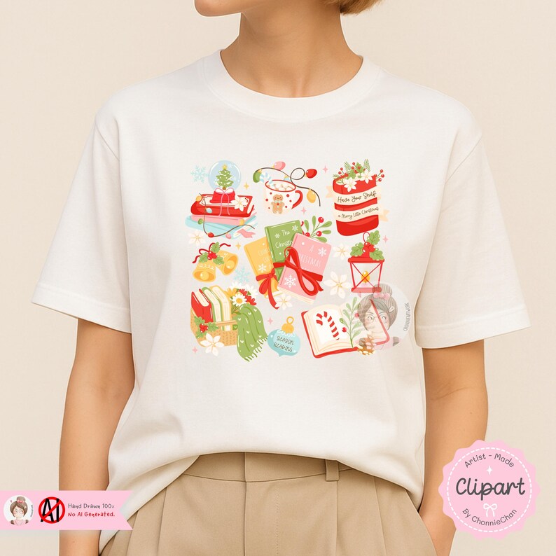 May include: Cream-colored t-shirt featuring a colorful Christmas-themed graphic. The design includes illustrations of a snow globe, wrapped gifts, books, bells, and a lantern. The words "Have a Beary Shelfy Christmas" are visible.