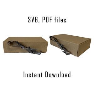 Może przedstawiać: Dwa brązowe pudełka kartonowe z czarną wstążką zawiązaną wokół. Pudełka są oznaczone "SVG, PDF files" i "Natychmiastowe pobranie".